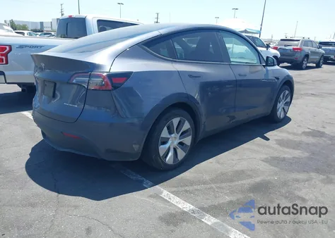 2023 Tesla Model Y Awd/Long Range Dual Motor All-Wheel Drive z USA, uszkodzony, nr VIN 7SAYGDEE7PA106824